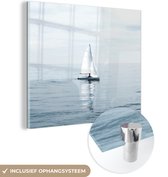MuchoWow® Glasschilderij 90x90 cm - Schilderij acrylglas - Zeilboot - Blauw - Water - Foto op glas - Schilderijen