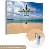 MuchoWow® Glasschilderij 120x80 cm - Schilderij acrylglas - Strand - Zee - Vliegtuig - Foto op glas - Schilderijen