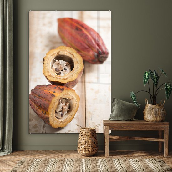 Peinture sur verre MuchoWow® - La coque de la gousse en deux avec les fèves de cacao au milieu - 100x150 cm - Peintures sur verre acrylique - Photo sur Glas
