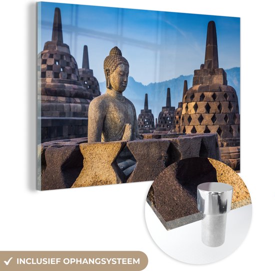 MuchoWow® Glasschilderij 150x100 cm - Schilderij acrylglas - Boeddha standbeeld in Borobudur tempel - Foto op glas - Schilderijen