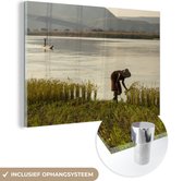 MuchoWow® Glasschilderij 90x60 cm - Schilderij acrylglas - Boerin - Rijst - Water - Afrika - Foto op glas - Schilderijen