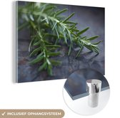 MuchoWow® Glasschilderij 60x40 cm - Schilderij acrylglas - Groene rozemarijn op een donkere tafel - Foto op glas - Schilderijen