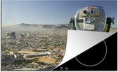 KitchenYeah® Inductie beschermer 76x51.5 cm - Een verrekijker houdt toezicht vanuit de bergen op de stad El Paso in de Verenigde Staten - Kookplaataccessoires - Afdekplaat voor kookplaat - Inductiebeschermer - Inductiemat - Inductieplaat mat