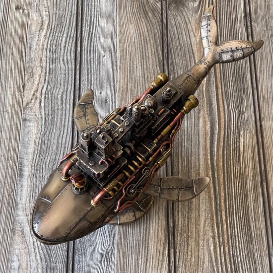 Top view steampunk walvis met fabriek, bronzen afwerking, op houten ondergrond.