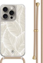 Casimoda® - Coque iPhone 15 Pro avec cordon beige - Feuilles de palmier beiges - Cordon amovible - TPU/polycarbonate