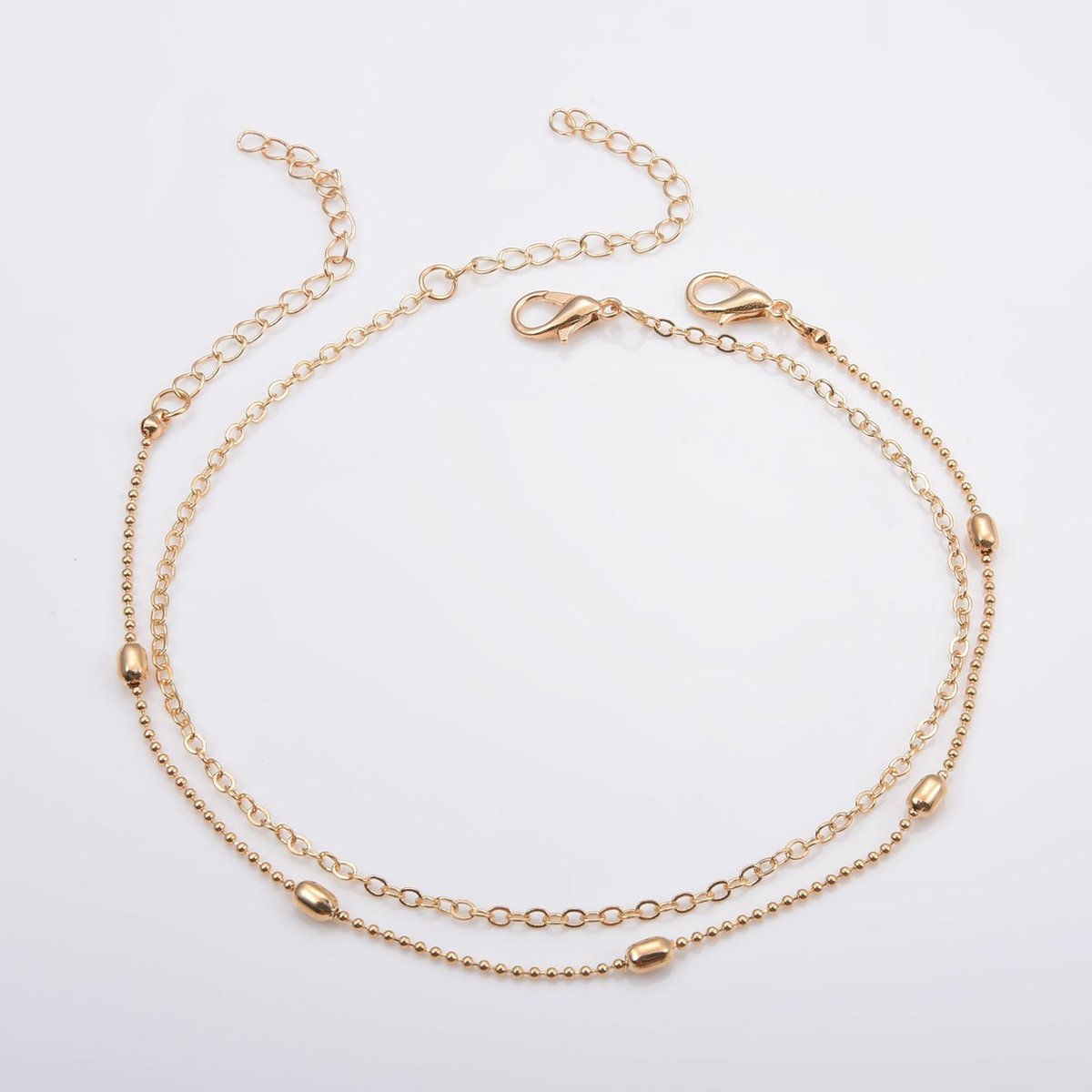 2 Enkelbandjes met ovaaltjes | goud gekleurd