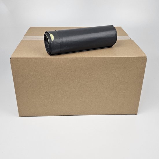 Rol zwarte vuilniszakken naast een kartonnen doos. De zakken zijn van KOMO en gemaakt van gerecycled plastic.