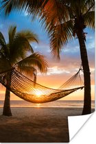 Caribische eilanden met een strand en hangmat Poster 60x90 cm - Foto print op Poster (wanddecoratie woonkamer / slaapkamer) / Zee en Strand