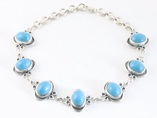 Bewerkte zilveren armband met blauwe opaal