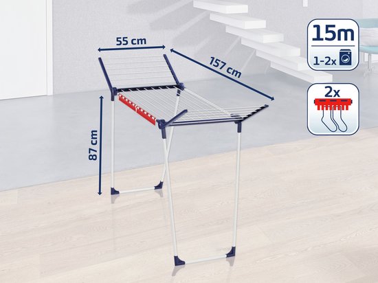 Wit droogrek met blauwe en rode accenten, met afmetingen aangegeven: 87 cm hoog, 157 cm lang, 55 cm breed.