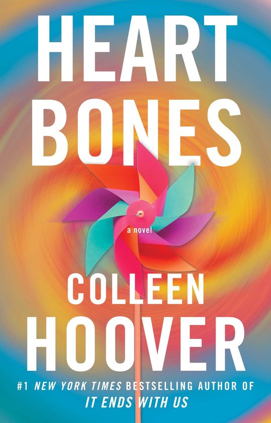 Livre "Heart Bones" par Colleen Hoover, avec un moulin à vent coloré sur un fond rose et orange.