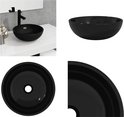 Lavabo noir en verre trempé, avec robinet noir.
