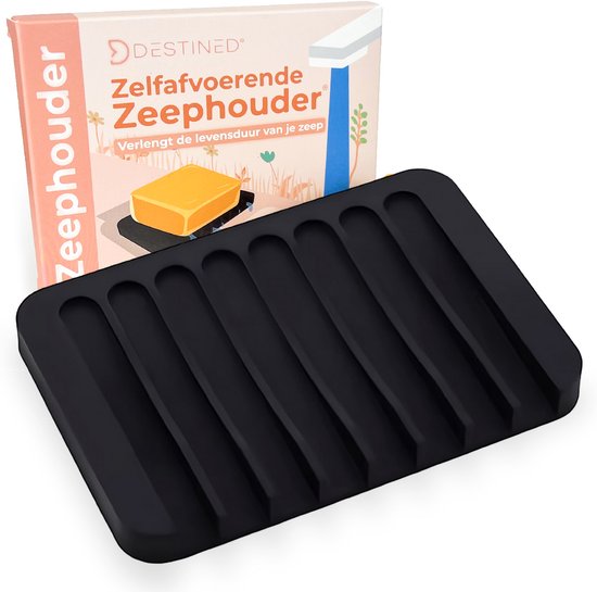 Zwart zeepbakje met ribbels, naast een verpakking met gele zeep.