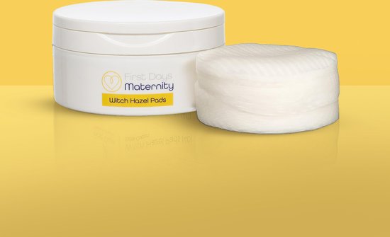 Witch Hazel Pads pot met een stapel ronde wattenschijfjes ernaast.