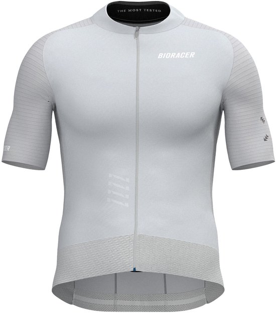 Avant du maillot de cyclisme beige à manches courtes, fermeture éclair, logo 'BIORACER' et texte 'THE MOST TESTED'.
