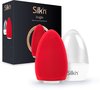 Een rode Silk'n Bright gezichtsreiniger en houder, naast de zwarte verpakking.