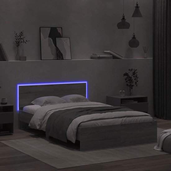 Bedframe met LED-verlichting in blauw, in een slaapkamer in grijs sonoma-eikenfineer.
