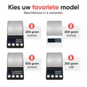 Quatre modèles de balances numériques : deux noires et deux blanches, avec une surface de pesée argentée. Certaines indiquent '200 grammes batterie', une '500 grammes batterie' et une '200 grammes USB'.