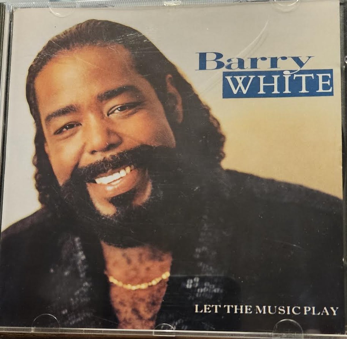 Barry White . Let the music play