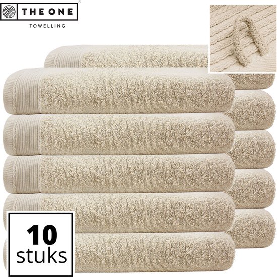 Dix draps de plage beige clair de 100x180 cm empilés, avec un détail en gros plan.