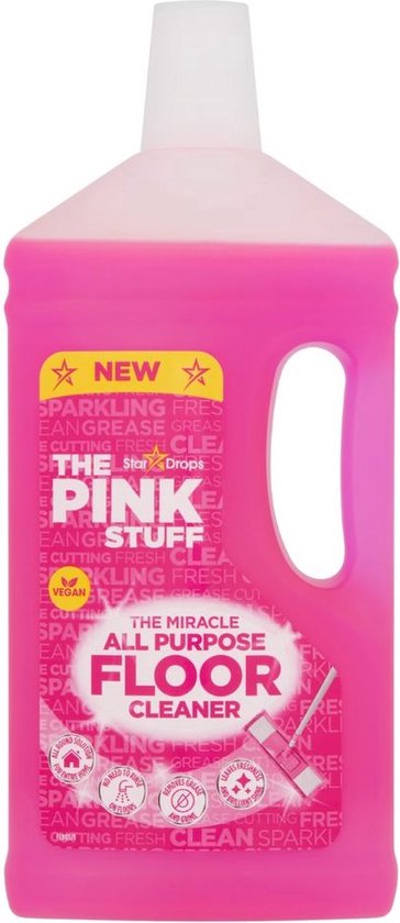 Fles 'The Pink Stuff' allesreiniger met roze vloeistof en een etiket met de tekst 'THE MIRACLE ALL PURPOSE FLOOR CLEANER'.