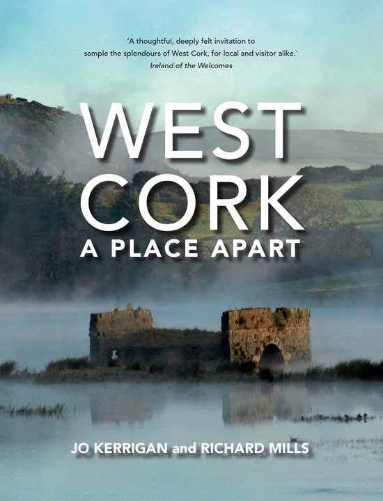 Boekcover met de titel 'WEST CORK A PLACE APART'. Een mistig landschap met ruïnes op een eiland in een meer.
