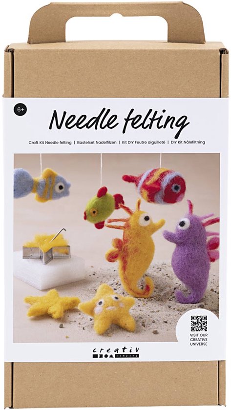 Emballage en carton avec le texte 'Needle felting'. Montre un kit de feutrage avec des animaux marins tels que poissons, hippocampes et étoiles de mer.