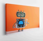 Canvas schilderij - Robot repairman with hand wrench light bulb. Fixing maintenance concept. Creative design mechanical toy character. Orange wall, backlighting on. Copy space.  -