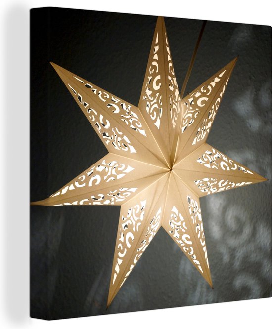Canvas Schilderij Een verlichtte ster tijdens de winter - 90x90 cm -  Wanddecoratie | bol.com