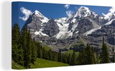 Canvas Schilderij Bossen voor de bergen de Eiger en Monch in Zwitserland - 80x40 cm - Wanddecoratie