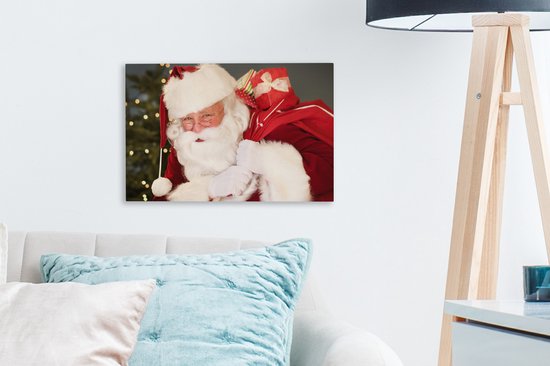 Un portrait du Père Noël portant un sac rouge sur son épaule toile 30x20 cm - petit - Tirage photo sur toile (Décoration murale salon / chambre)