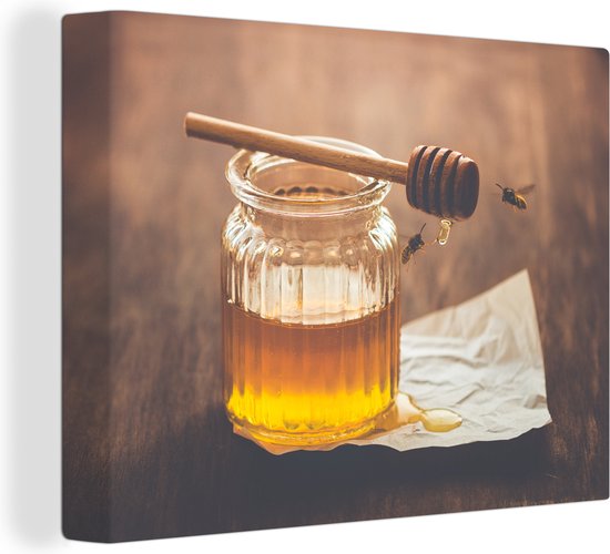 Tableau sur toile Miel avec des abeilles qui volent - 80x60 cm - Décoration murale