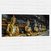 Muursticker - Rijen Gouden Boeddha's in Wat Tham Khuha Sawan Tempel in Thailand - 100x50 cm Foto op Muursticker