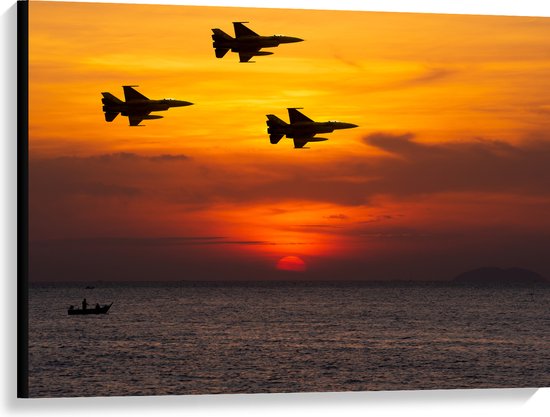 Canvas - Silhouet van Straaljagers boven de Zee tijdens Zonsondergang - 100x75 cm Foto op Canvas Schilderij (Wanddecoratie op Canvas)