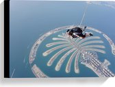 Canvas - Parachutespringer boven de Palm van Dubai - 40x30 cm Foto op Canvas Schilderij (Wanddecoratie op Canvas)