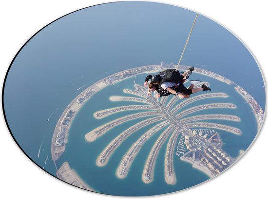 Dibond Ovaal - Parachutespringer boven de Palm van Dubai - 40x30 cm Foto op Ovaal (Met Ophangsysteem)
