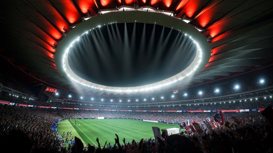 Voetbalstadion met ronde verlichting en publiek dat rode vlaggen zwaait.