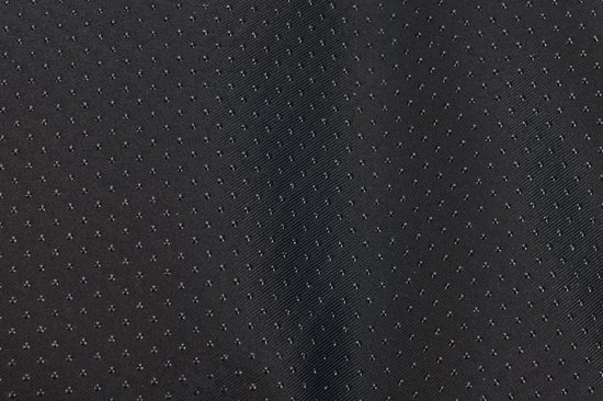 Gedetailleerde close-up van de zwarte, antislip onderkant van een hondenmand.