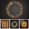 Couronne LED blanc chaud de 38 cm avec 8 fonctions, idéale pour l'intérieur et l'extérieur.