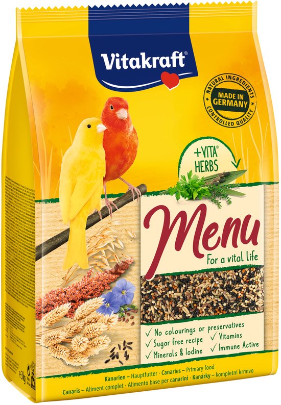 Gele en rode kanarie op een tak met granen en zaden, op een gele verpakking van Vitakraft Menu.
