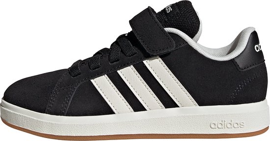 Zwarte adidas sneaker met witte strepen en klittenband, gezien vanaf de zijkant.
