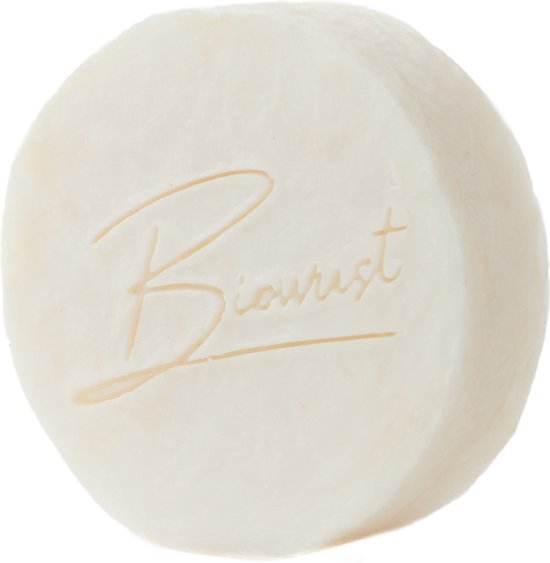 Ronde, off-white scheerzeep met 'Biowust' logo in reliëf.
