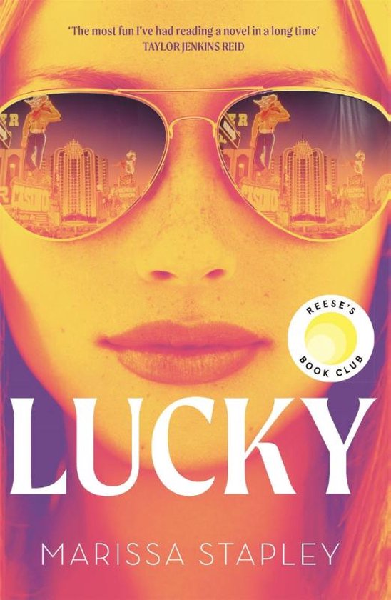 Couverture du livre 'Lucky' par Marissa Stapley, montrant une femme portant des lunettes de soleil avec des reflets d'une ville et de casinos.