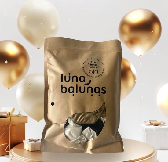 Papieren verpakking met 'Luna Balunas' logo, deels gevuld met gouden, witte en zwarte ballonnen. Omringd door gouden en witte ballonnen.