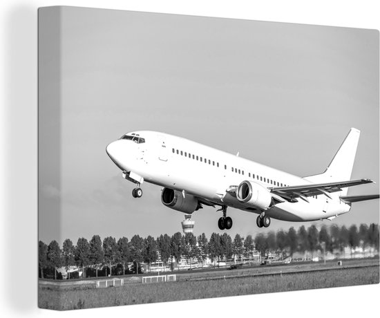 Canvas Schilderij Opstijgend vliegtuig bij Schiphol - zwart wit - 60x40 cm - Wanddecoratie