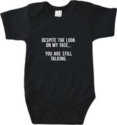 Rompertjes baby met tekst - Despite the look on my face, you are still talking - Romper zwart - Maat 74/80
