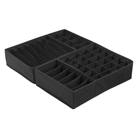 Zwarte opbergboxen met diverse vakverdelingen voor het organiseren van kleding.
