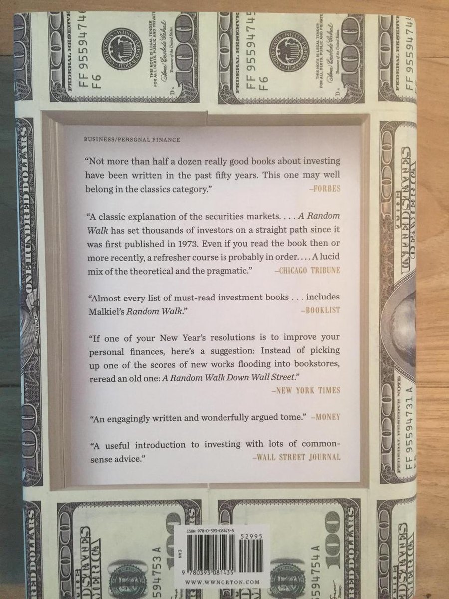 Boek "A Random Walk Down Wall Street" met dollar-opdruk. Tekst recensies.