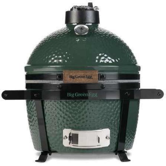 Donkergroene Big Green Egg barbecue met thermometer, houten handvat, zijhandgrepen en zwarte pootjes.