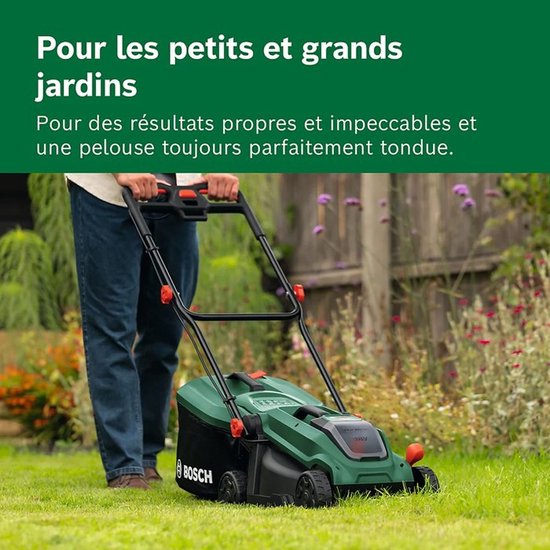 Man maait gras met groene Bosch grasmaaier in een tuin.